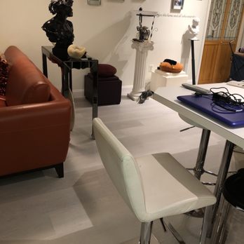 Mighty Oak Flooring - a work area with a desk, chair, and sculpture - Refinishing Services Near Me - Westwood, New Jersey Mighty Oak Flooring - a work area with a desk, chair, and sculpture - Refinishing Services Near Me - Westwood, New Jersey