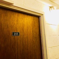 Asian Horizons - Walk up the stairs to the second floor, room #205. It's the door directly under the only hallway light.