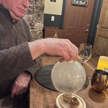 Candle in the Woods - Smoked scallop under glass boobie. - Wine Bars Near Me - Athol, Idaho