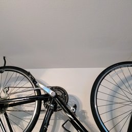 FIXED: repositioned bike hooks, plugged holes, painted over the spackle