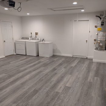 Hartmann Maginniss Construction - a laundry room with a washer and dryer - General Contractors Near Me