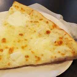 Bklyn's Pizza - White slice, bitten once.