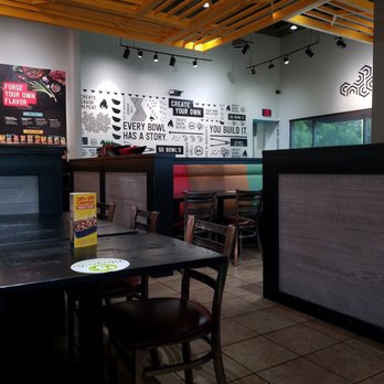 Genghis Grill - The wall of create your own bowl. Each bowl has a story. - Mongolian Near Me - Duncanville, Texas