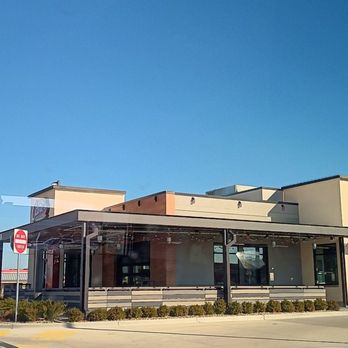 Raising Cane's Chicken Fingers - The raising canes restaurant outside area. - Fast Food Near Me - Champaign, Illinois Raising Cane's Chicken Fingers - The raising canes restaurant outside area. - Fast Food Near Me - Champaign, Illinois