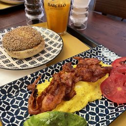 California "omelette" with sesame bagel and carrot ginger juice California "omelette" with sesame bagel and carrot ginger juice