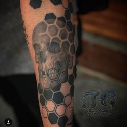 Game Face Tattoos - Geometric honeycomb skull black and grey tattoo.