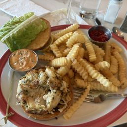 Partially eaten crab cake sandwich. Delicious Partially eaten crab cake sandwich. Delicious
