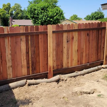 Ergeon - I placed the logs in front of the bottom boards because one of my dogs is a digger! lol - Fences & Gates Near Me - Sacramento, California Ergeon - I placed the logs in front of the bottom boards because one of my dogs is a digger! lol - Fences & Gates Near Me - Sacramento, California