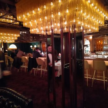 Golden Steer at One Fifth - The Lounge seating area and the bar with lighting to set the mood. - Steakhouses Near Me - New York, New York Golden Steer at One Fifth - The Lounge seating area and the bar with lighting to set the mood. - Steakhouses Near Me - New York, New York