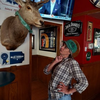 Ringer's Cocktail Lounge - a woman standing in front of a deer head - Lounges Near Me - Bonsall, California Ringer's Cocktail Lounge - a woman standing in front of a deer head - Lounges Near Me - Bonsall, California