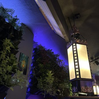 Back 2 Earth - a tall lamp hanging from the ceiling - Bars Near Me - Portland, Oregon