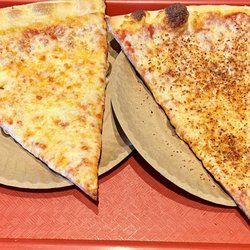 Ferro's Famous New York Pizza - 2 slice special (cheese pizza with crushed red pepper on the right).