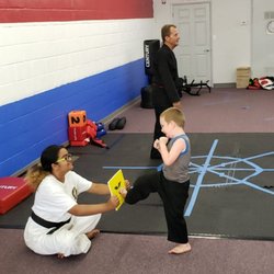Cover6ix Taekwondo Academy - One of our students practicing board breaking.