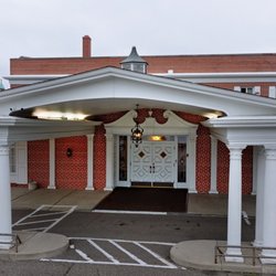 Bradshaw Funeral & Cremation - The white-columned portico of Bradshaw's original funeral home on Rice Street in Saint Paul's North End