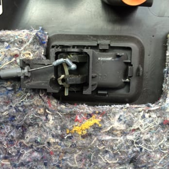 Auto Safe & Sound - Poor-quality in 2007, discovered in 2015: Close-up of broken door lock switch assembly with pieces of the holding cable tie. - Auto Detailing Near Me - Tampa, Florida Auto Safe & Sound - Poor-quality in 2007, discovered in 2015: Close-up of broken door lock switch assembly with pieces of the holding cable tie. - Auto Detailing Near Me - Tampa, Florida