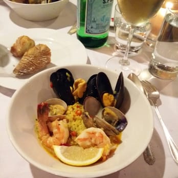 The Harvest Vine - "Hay Muchos Peces en el Mar; brothy saffron rice with mussels, clams, and prawns. - Tapas Bars Near Me - Seattle, Washington The Harvest Vine - "Hay Muchos Peces en el Mar; brothy saffron rice with mussels, clams, and prawns. - Tapas Bars Near Me - Seattle, Washington