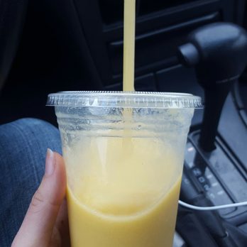The Juice Company Cafe - a hand holding a cup of juice - Juice Bars & Smoothies Near Me - Ankeny, Iowa The Juice Company Cafe - a hand holding a cup of juice - Juice Bars & Smoothies Near Me - Ankeny, Iowa