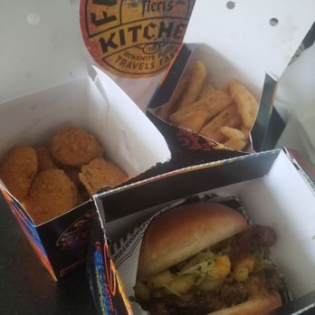 Guy Fieri's Flavortown Kitchen - Bacon mac n cheese burger, fried pickles, fries - Food Delivery Services Near Me