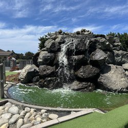 Emerald Dolphin Mini Golf - waterfall in the center of the course!
