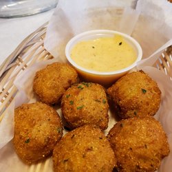 The Crab House - Hush puppies served with seasoning similar to good times sauce. Good but a little doughy