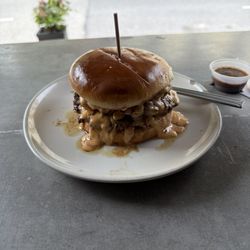 Whiskey burger. Bacon, jalapeño, beer cheese, double smash burger. No onions .