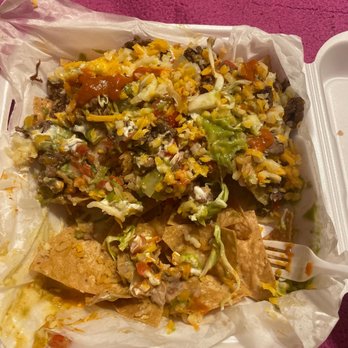 Albaro's - There food is expensive and not so good there skimpy with there meat I ordered a supreme carné asada nachos just beans tomatoes and cheese - Mexican Near Me - Highland, California