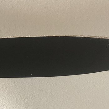 Queen of Maids - Photo of one of the ceiling fan blade in my bedroom with all the dust still caked onto the blade - Home Cleaning Near Me Queen of Maids - Photo of one of the ceiling fan blade in my bedroom with all the dust still caked onto the blade - Home Cleaning Near Me