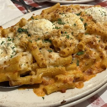 Buca di Beppo Italian Restaurant - Baked Ziti - mozzarella, provolone & rosa sauce tossed & topped w/ ricotta & Italian-style bread crumbs! - Italian Near Me - Universal City, California Buca di Beppo Italian Restaurant - Baked Ziti - mozzarella, provolone & rosa sauce tossed & topped w/ ricotta & Italian-style bread crumbs! - Italian Near Me - Universal City, California