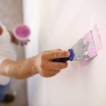 TCM Drywall - a man painting a wall - Drywall Installation & Repair Near Me - Rescue, California