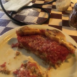a slice of deep dish pizza a slice of deep dish pizza