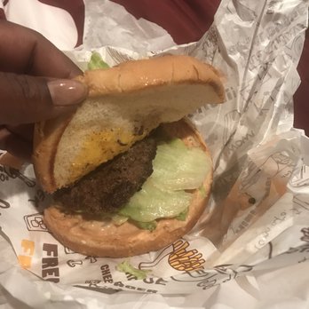 Sno-White Drive In - I ordered the cheeseburger and this is what I got. The patty is the smallest item. The patty only covers 1/2 of the oversized bun. - Burgers Near Me - Modesto, California
