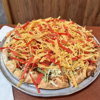Spooky's Pizza - a pizza covered in shredded cheese - Pizza Near Me - The Dalles, Oregon