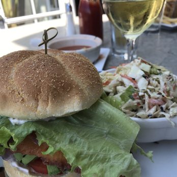 Paradise Beach Grille - Halibut Burger with Slaw and a glass of Conundrum wine. - New American Near Me - Capitola, California Paradise Beach Grille - Halibut Burger with Slaw and a glass of Conundrum wine. - New American Near Me - Capitola, California