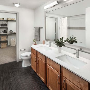 Camden Design District Apartments - Bathroom with two sinks and walk-in closet at Camden Design District apartments in Dallas, TX - Apartments Near Me - Dallas, Texas Camden Design District Apartments - Bathroom with two sinks and walk-in closet at Camden Design District apartments in Dallas, TX - Apartments Near Me - Dallas, Texas