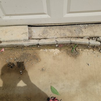 Construction Pros - a shadow of a person holding an umbrella - Masonry/Concrete Near Me
