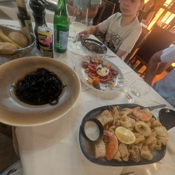 La Piazza - House made pasta with cuttle fish ink, burratta with tri-colored tomatoes, and Ducal Grand Fry. - Venetian Near Me - Venezia, VE La Piazza - House made pasta with cuttle fish ink, burratta with tri-colored tomatoes, and Ducal Grand Fry. - Venetian Near Me - Venezia, VE
