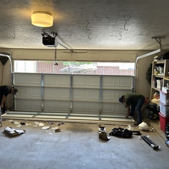 911 Garage Pros - 3/4ths of the new garage door already replaced the old door  in less than 1 hour.  Thank you Dan W. - Garage Door Services Near Me - Dallas, Texas