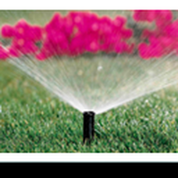 Alfredos lawn service - a sprinkler spraying water on a lawn - Lawn Services Near Me