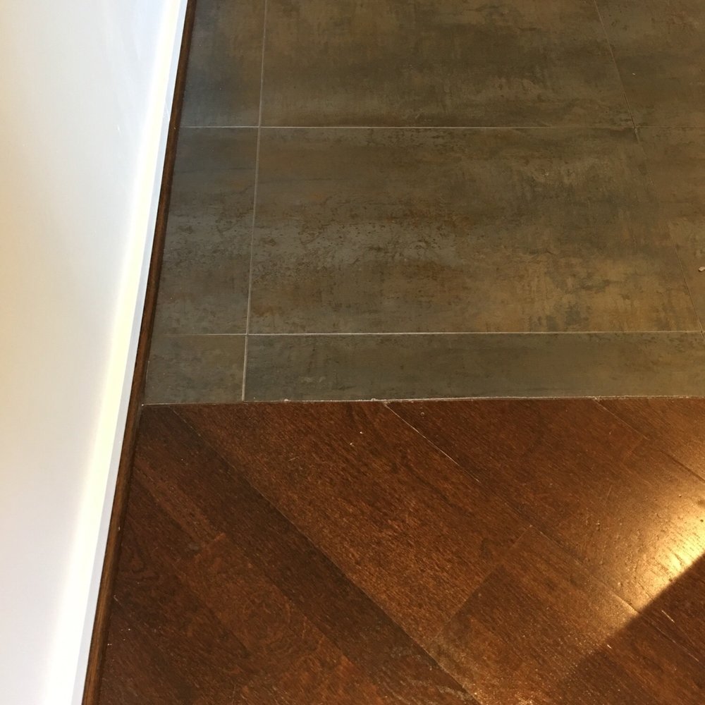 Factor HD - Tile next to hardwood... we have some concrete walls so the look is perfect. - Building Supplies Near Me - Woodland Hills, California Factor HD - Tile next to hardwood... we have some concrete walls so the look is perfect. - Building Supplies Near Me - Woodland Hills, California