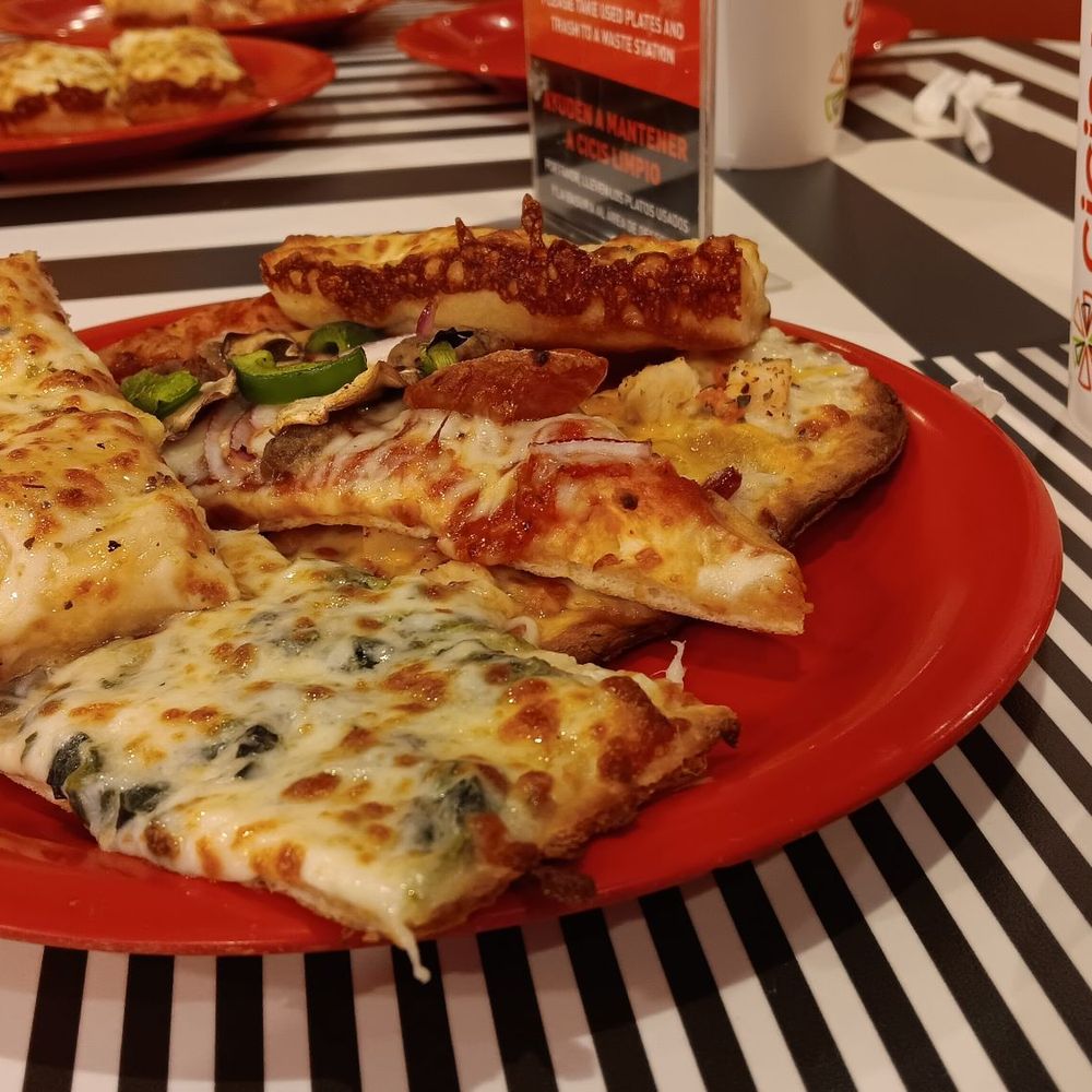 Cicis Pizza - a red plate with slices of pizza on it - Pizza Near Me - Orangeburg, South Carolina