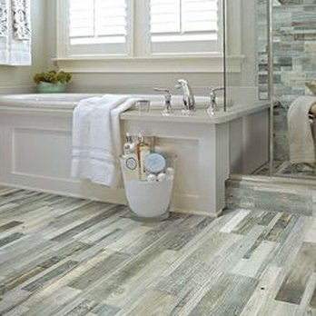 Everett Carpet & Flooring - a bathroom with wood flooring - Carpeting Near Me - Midland, Michigan Everett Carpet & Flooring - a bathroom with wood flooring - Carpeting Near Me - Midland, Michigan