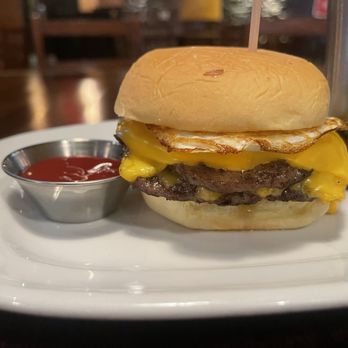 Stout NYC - Double smash Cheeseburger with extra cheese and an over easy egg on top. Soooo delicious! - Irish Near Me - New York, New York Stout NYC - Double smash Cheeseburger with extra cheese and an over easy egg on top. Soooo delicious! - Irish Near Me - New York, New York