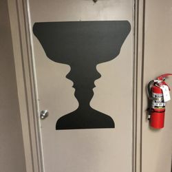 Professional Eye Care - Is it two people looking up, or a goblet??