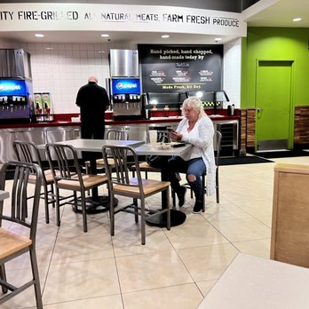 Baja Fresh - a woman sitting at a table in a restaurant - Mexican Near Me - Las Vegas, Nevada