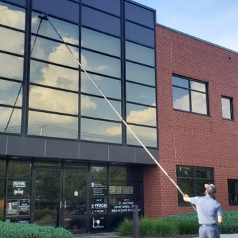Shambaugh's Window Cleaning - Waterfed pole cleaning on tall office windows - Window Washing Near Me Shambaugh's Window Cleaning - Waterfed pole cleaning on tall office windows - Window Washing Near Me