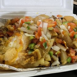Adelitas Food Truck - Asada fries add chicharrone. Soggy fries and nearly vegetarian in lacking meat.