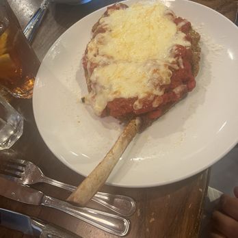 Lucca Italian Chophouse - Bone in veal Parmesan with side of broccoli - Italian Near Me - Shallotte, North Carolina