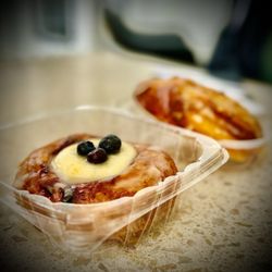 La Parisienne - Cream cheese Blueberry Croissant. Background is an Almond brioche.