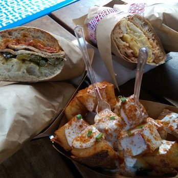 Tumaca Truck - Lomo Con Queso on Ciabatta ($15), Tortilla on baguette ($10) and Tumaca Fries ($5)--all perfectly made - Food Trucks Near Me