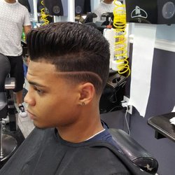 Exclusive Cuts Barber Shop - This is a comb over with a blow out and a line